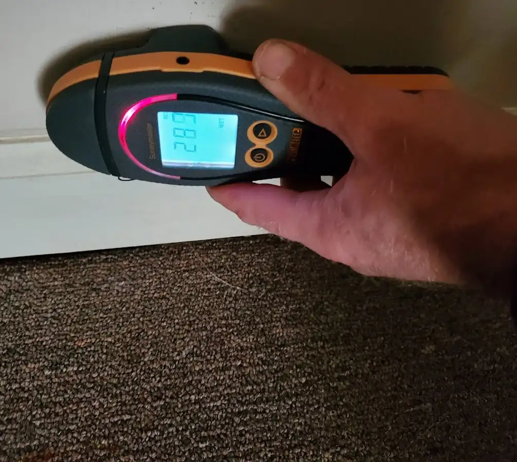 Moisture detection at baseboard during Storm Damage Restoration in Rantoul